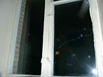 Простреленные окна в квартире Бровкина
